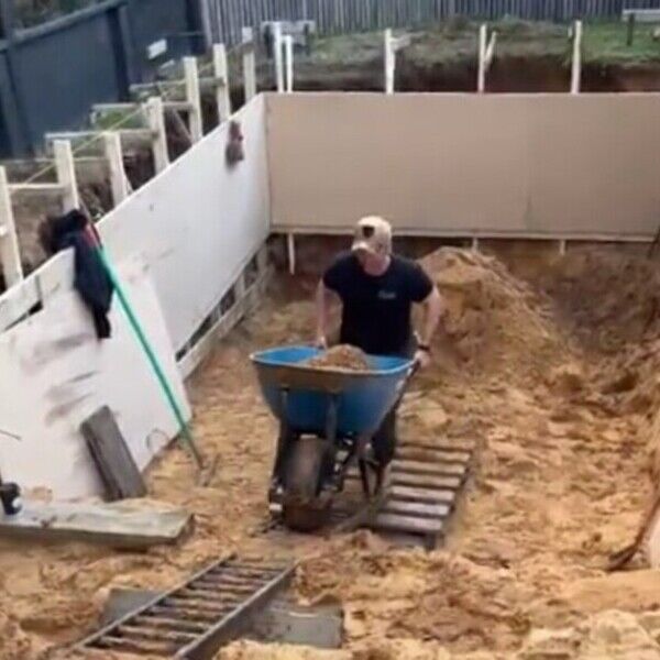 Motorised Wheelbarrow in soft sand